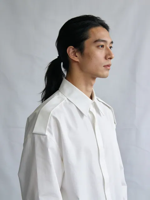 Generated studio portrait, a young man in a white shirt